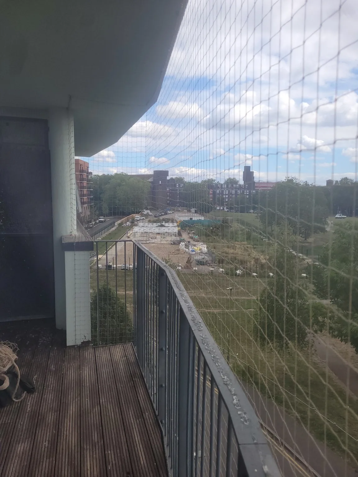 Internal balcony view showing net coverage