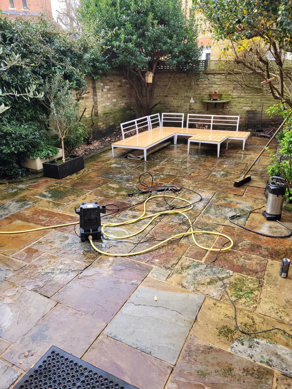 Patio during and after pressure cleaning work